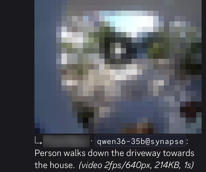 Follow-up reply from qwen36-35b@synapse: 'Person walks down the driveway towards the house. (video 2fps/640px, 214KB, 1s)'. The camera frame is pixelated.